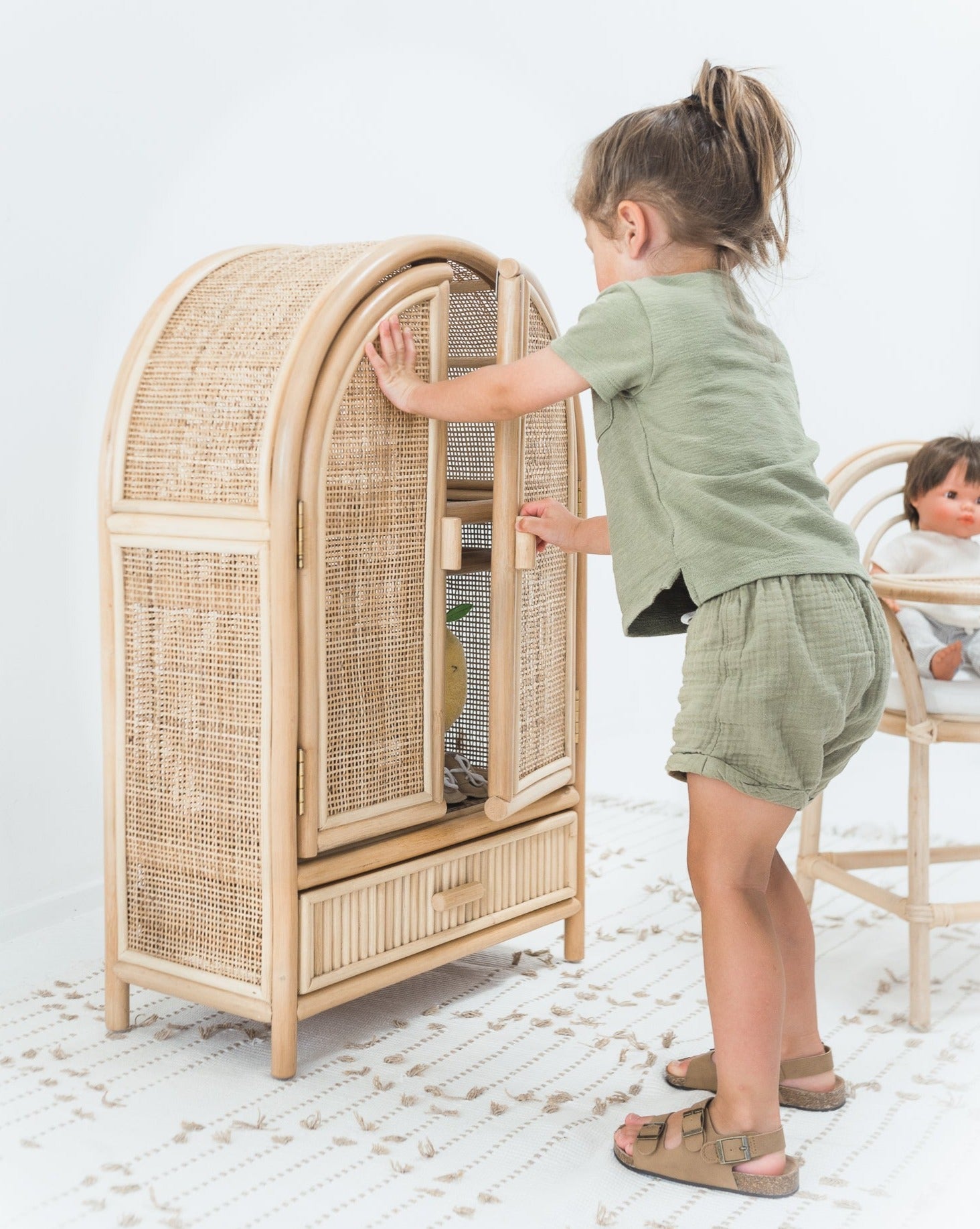 https://rompathome.com/cdn/shop/products/ellieandbecks-sloanedollcabinet-dollwardrobe-rattancabinet-1.jpg?v=1681215866&width=1946